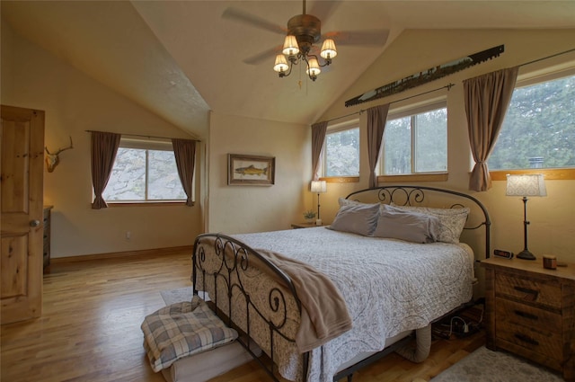 6961 Mt Highway 200, Plains, MT 59859 - bedroom with vaulted ceiling, light wood-type flooring, a ceiling fan, and baseboards