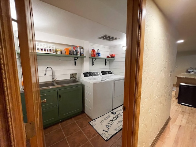 6961 Mt Highway 200, Plains, MT 59859 - laundry room with a textured wall, cabinet space, washing machine and dryer, and bar with sink