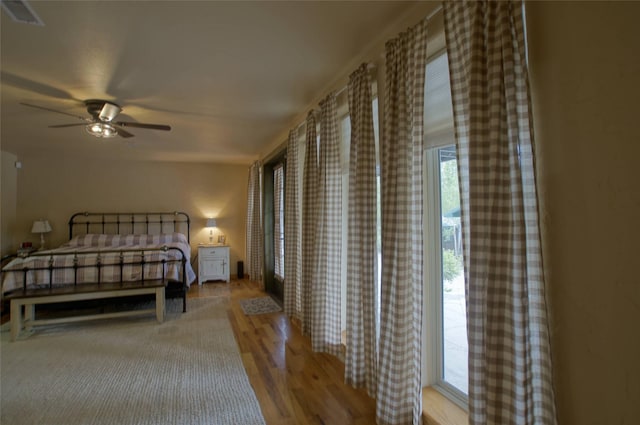 6961 Mt Highway 200, Plains, MT 59859 - bedroom featuring wood finished floors and ceiling fan