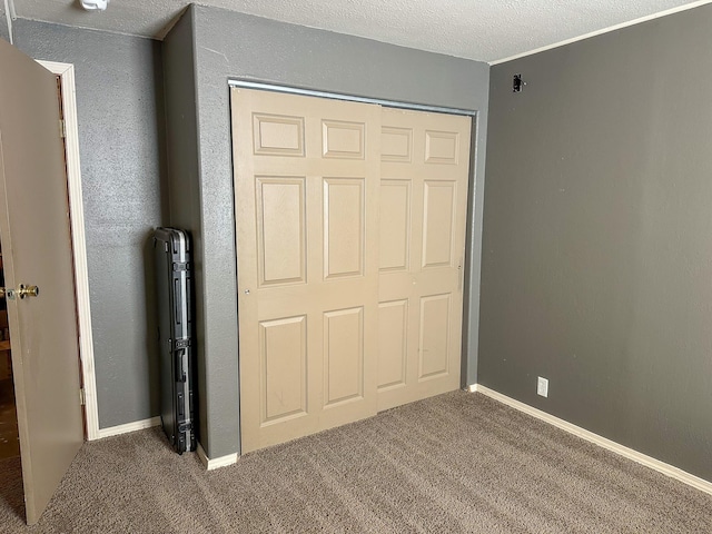 325 River Dr, Lolo, MT 59847 - unfurnished bedroom featuring carpet floors and a closet