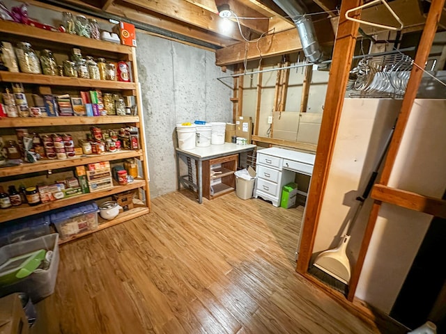 325 River Dr, Lolo, MT 59847 - unfinished basement featuring wood finished floors and freestanding refrigerator