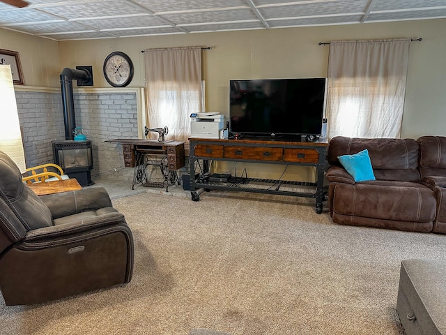 325 River Dr, Lolo, MT 59847 - living room featuring carpet and a wood stove