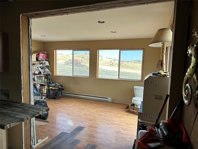 14 Sidehill Trl, Ennis, MT 59729 - interior space with a baseboard heating unit and wood finished floors
