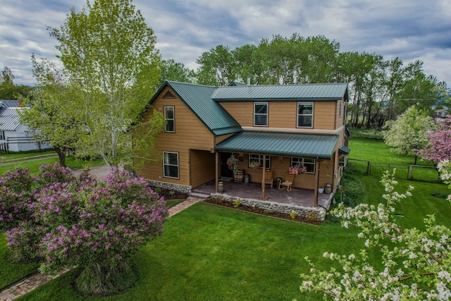 412 Mill St, Sheridan, MT 59749 - back of house with metal roof and covered porch