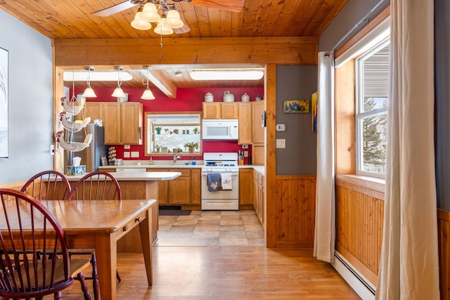 412 Mill St, Sheridan, MT 59749 - kitchen with white appliances, wooden walls, light countertops, wooden ceiling, and a ceiling fan
