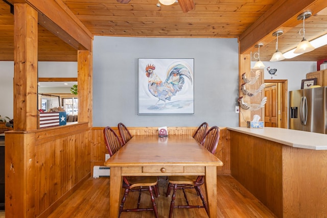 412 Mill St, Sheridan, MT 59749 - dining room with wood finished floors, wooden ceiling, baseboard heating, ceiling fan, and wood walls