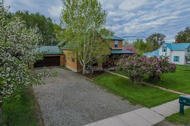 412 Mill St, Sheridan, MT 59749 - view of front facade with metal roof, a front lawn, driveway, and a garage
