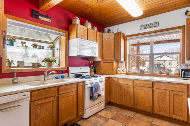 412 Mill St, Sheridan, MT 59749 - kitchen with white appliances, a sink, wooden ceiling, light countertops, and brown cabinets
