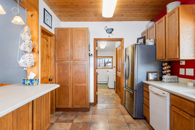 412 Mill St, Sheridan, MT 59749 - kitchen with white dishwasher, brown cabinets, washer / clothes dryer, light countertops, and wood ceiling