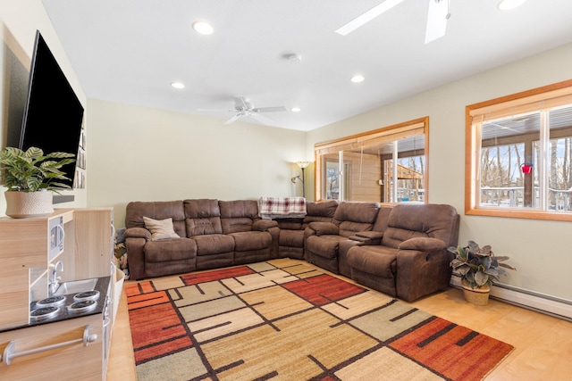 412 Mill St, Sheridan, MT 59749 - living area featuring a ceiling fan, recessed lighting, light wood-style floors, a skylight, and baseboard heating