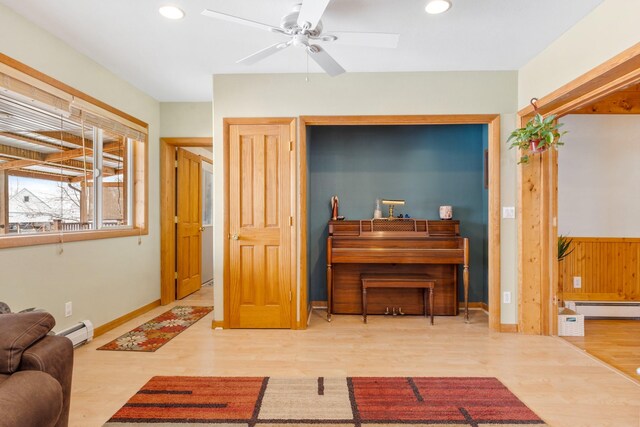 412 Mill St, Sheridan, MT 59749 - living room with a baseboard heating unit, ceiling fan, wood finished floors, and recessed lighting