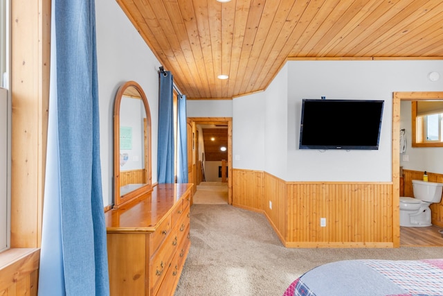 412 Mill St, Sheridan, MT 59749 - bedroom featuring wooden ceiling, wainscoting, wooden walls, carpet flooring, and ensuite bath