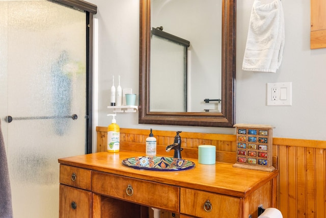412 Mill St, Sheridan, MT 59749 - bathroom featuring wood walls, vanity, and wainscoting