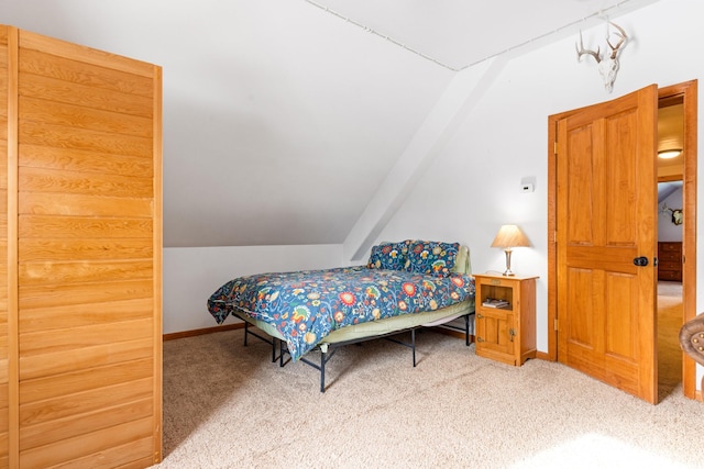412 Mill St, Sheridan, MT 59749 - carpeted bedroom featuring vaulted ceiling and baseboards