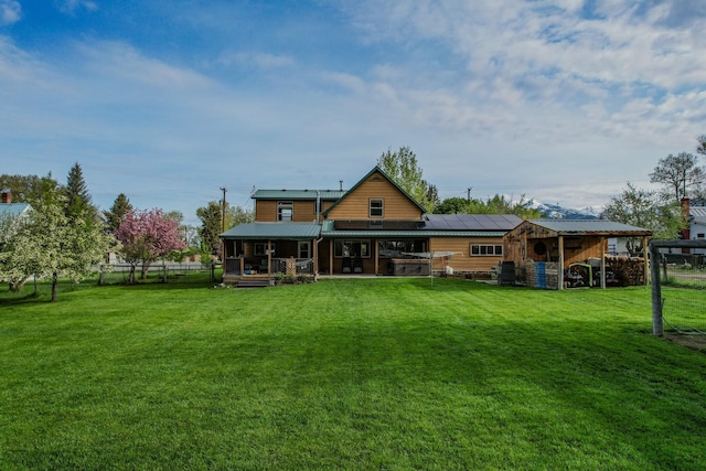412 Mill St, Sheridan, MT 59749 - rear view of property featuring solar panels and metal roof