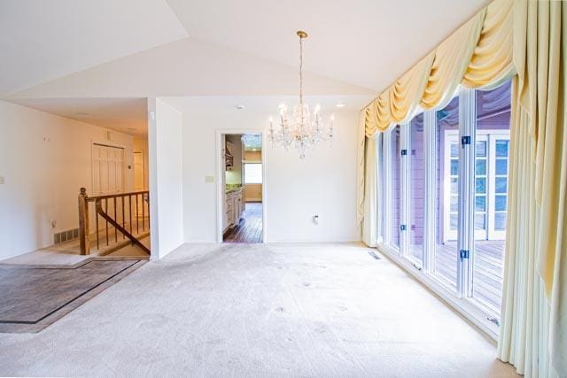 6 Cedar Lake Dr, Butte, MT 59701 - carpeted spare room with vaulted ceiling and a chandelier