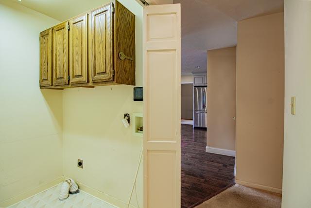 6 Cedar Lake Dr, Butte, MT 59701 - washroom featuring hookup for an electric dryer, cabinet space, washer hookup, and baseboards
