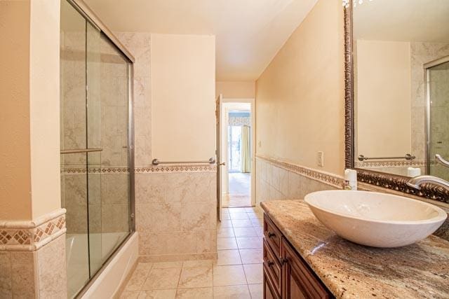 6 Cedar Lake Dr, Butte, MT 59701 - bathroom featuring tile walls, a wainscoted wall, vanity, and tile patterned flooring