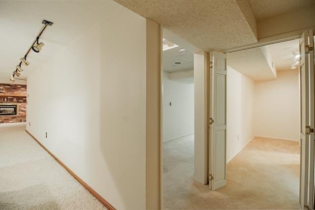 6 Cedar Lake Dr, Butte, MT 59701 - corridor featuring light colored carpet, track lighting, and baseboards