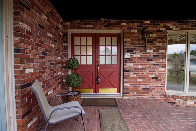 6 Cedar Lake Dr, Butte, MT 59701 - property entrance featuring brick siding and french doors