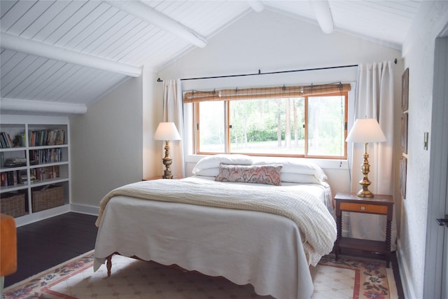 bedroom featuring wood finished floors and baseboards