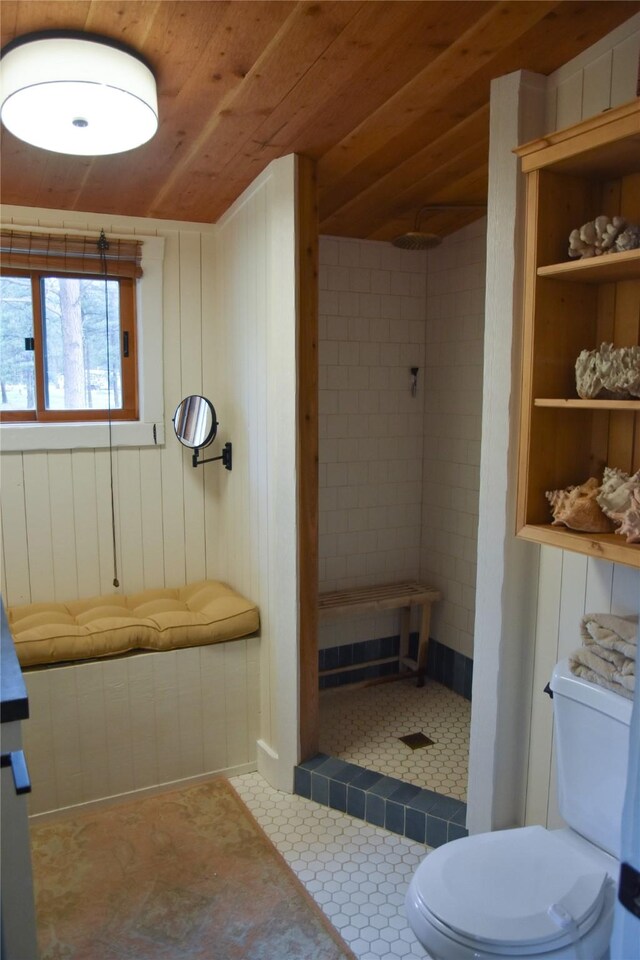 full bath with toilet, a tile shower, and wooden ceiling
