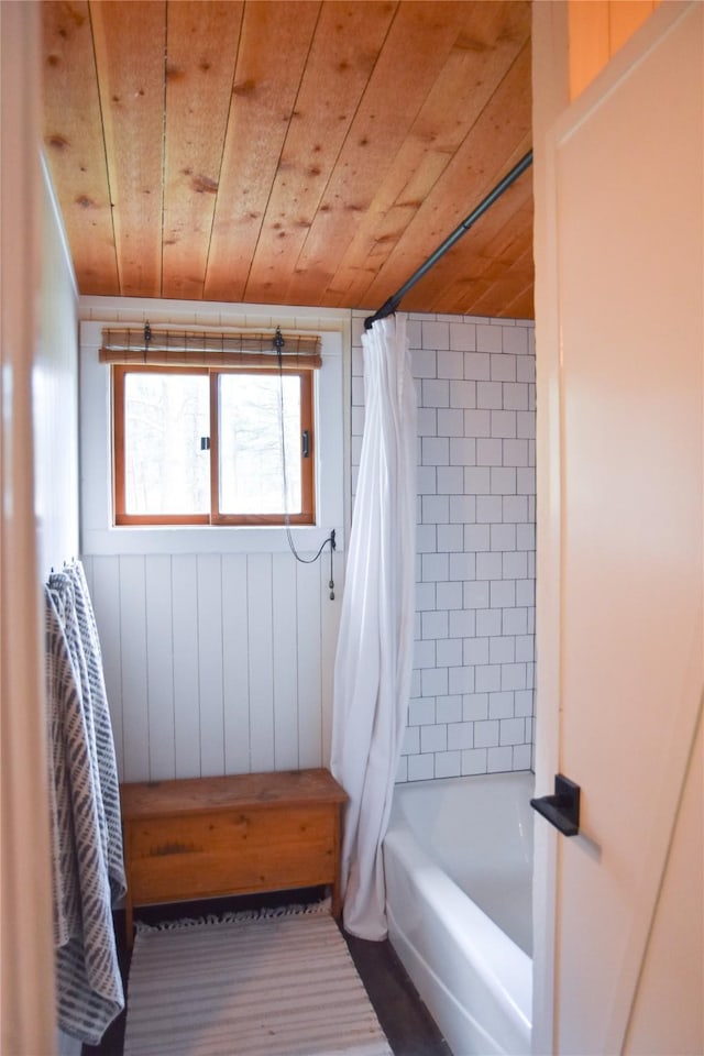full bath featuring wooden ceiling and shower / tub combo