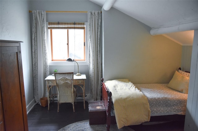 bedroom with vaulted ceiling and hardwood / wood-style floors