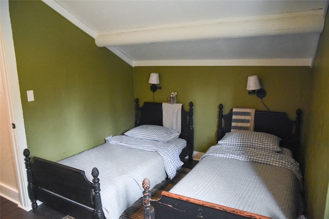 bedroom with dark wood-style flooring and baseboards