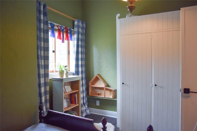 bedroom featuring baseboards