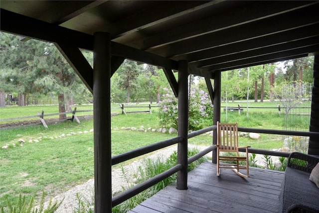 wooden terrace with a yard