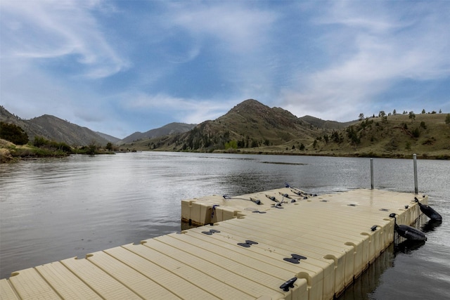 dock area featuring a water and mountain view