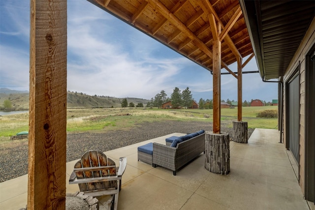 view of patio featuring a view of countryside and a mountain view