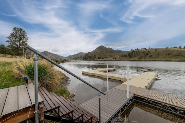 dock with a water and mountain view