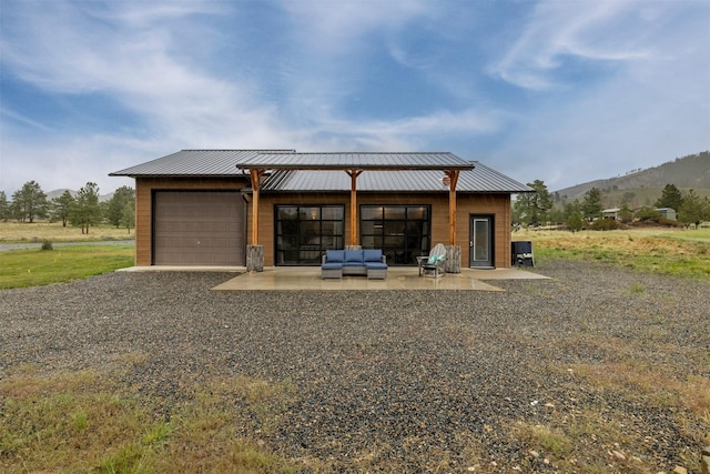 garage featuring a mountain view and driveway