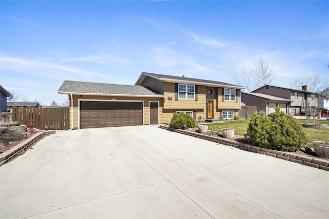 3768 Beechnut St, East Helena, MT 59635 - raised ranch with concrete driveway and a garage