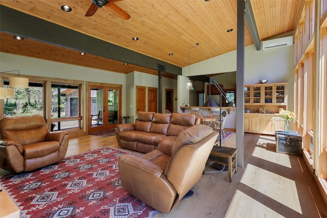 318 Mt Highway 56, Noxon, MT 59853 - living area featuring a wall mounted air conditioner, wood-type flooring, ceiling fan, wooden ceiling, and vaulted ceiling