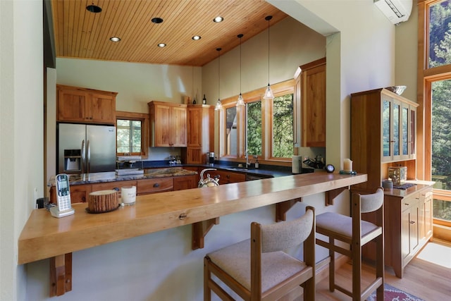 318 Mt Highway 56, Noxon, MT 59853 - kitchen featuring stainless steel fridge with ice dispenser, wood ceiling, recessed lighting, a sink, and brown cabinetry