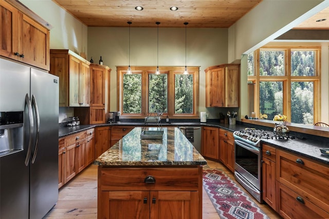 318 Mt Highway 56, Noxon, MT 59853 - kitchen featuring stainless steel appliances, light wood-type flooring, a center island, wooden ceiling, and brown cabinetry