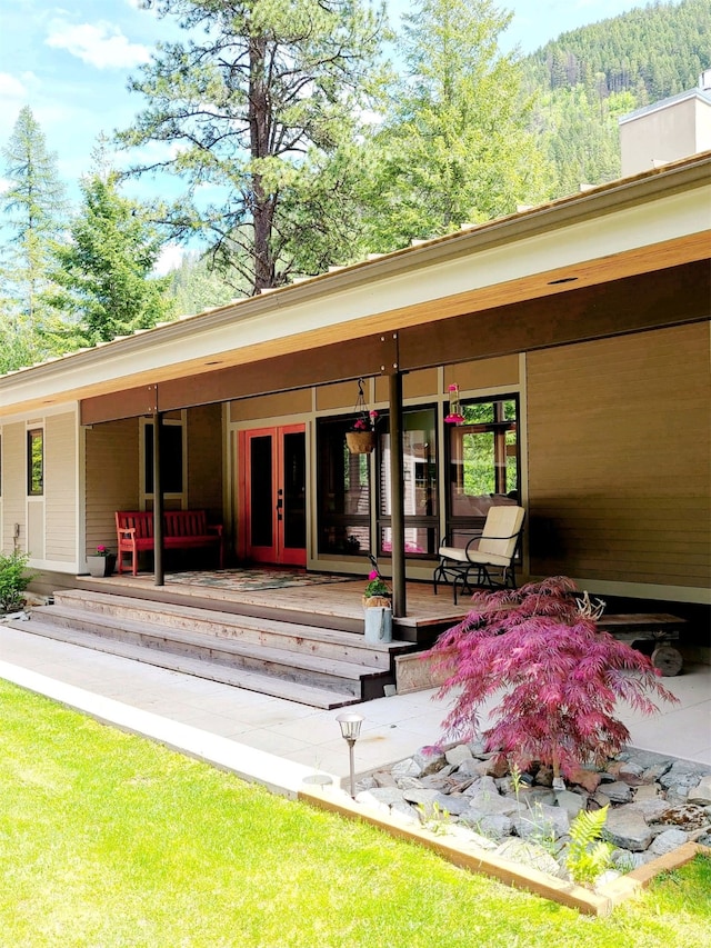 318 Mt Highway 56, Noxon, MT 59853 - back of house with french doors and a wooden deck