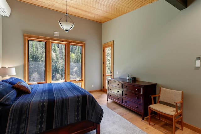 318 Mt Highway 56, Noxon, MT 59853 - bedroom featuring a wall mounted AC, wood ceiling, light wood-style floors, baseboards, and lofted ceiling