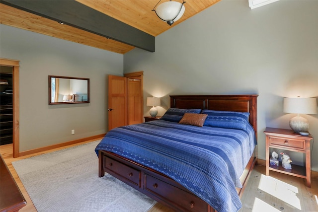 318 Mt Highway 56, Noxon, MT 59853 - bedroom with wood ceiling, wood finished floors, a walk in closet, and baseboards