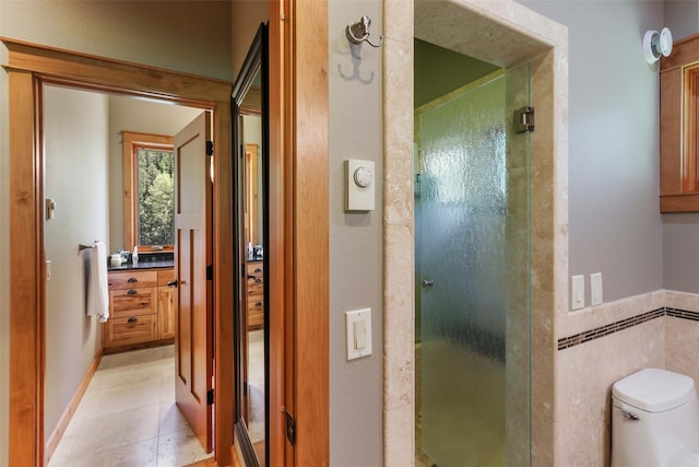 318 Mt Highway 56, Noxon, MT 59853 - full bath featuring a shower stall, toilet, tile patterned flooring, and tile walls