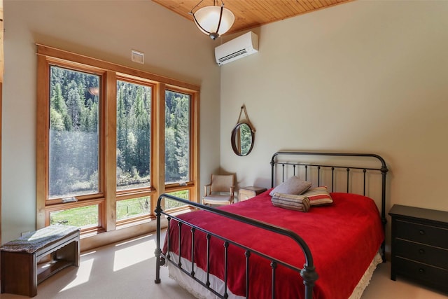 318 Mt Highway 56, Noxon, MT 59853 - bedroom featuring wood ceiling, multiple windows, carpet floors, and a wall mounted AC