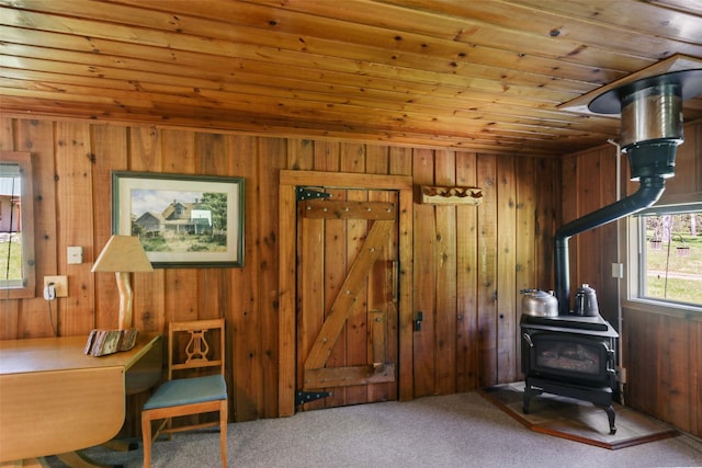 318 Mt Highway 56, Noxon, MT 59853 - office area featuring wood ceiling, a wood stove, wood walls, and carpet