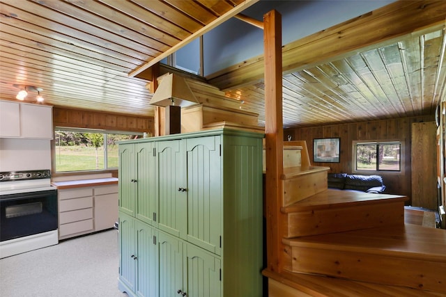 318 Mt Highway 56, Noxon, MT 59853 - kitchen with white electric range oven, green cabinetry, wood walls, and wooden ceiling