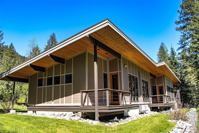 318 Mt Highway 56, Noxon, MT 59853 - view of home's exterior with a wooden deck and a lawn
