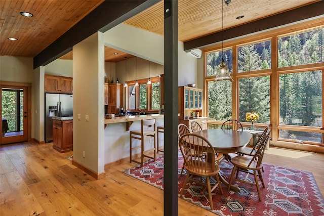318 Mt Highway 56, Noxon, MT 59853 - dining room with healthy amount of natural light, light wood-style flooring, recessed lighting, wooden ceiling, and an AC wall unit