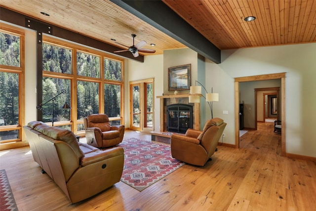 318 Mt Highway 56, Noxon, MT 59853 - living room featuring a ceiling fan, a fireplace, wooden ceiling, plenty of natural light, and light wood finished floors