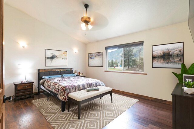 301 Bernie Rd, Alberton, MT 59820 - bedroom featuring lofted ceiling, dark wood-style floors, baseboards, and a ceiling fan